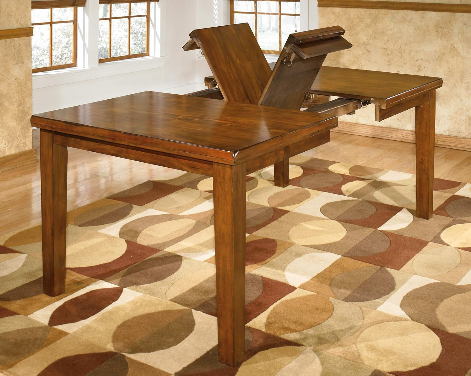 Ralene Medium Brown Dining Table With Butterfly Leaf